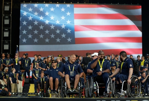 The entire United States team of athletes gather on stage during the closing ceremony at the Invictus Games, Thursday, May 12, 2016, in Kissimmee, Fla. (AP Photo/John Raoux)